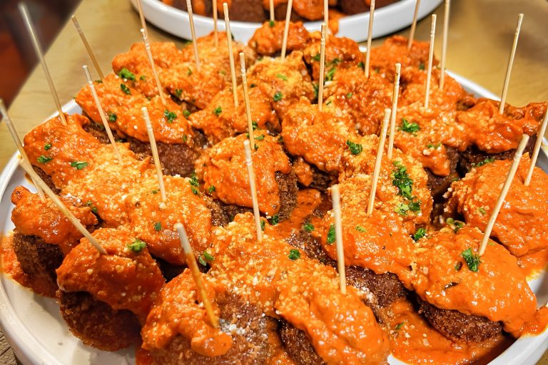 Garlic knot meatball sliders with skewers in a sharable option