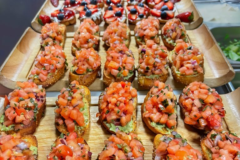 Amore catering options with bruschetta in focus and tarts out of focus